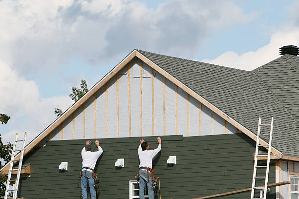 Professional Storm Damage Siding Repair technician working in Lawrenceburg, TN